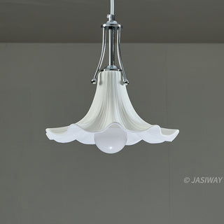 This pendant light features a graceful, trumpet-shaped ceramic shade with delicate, fluted ridges that evoke a refined botanical elegance. The creamy white finish is complemented by a sleek, polished chrome fixture, creating a harmonious balance between soft organic forms and structured metallic elements. Its minimalist yet sculptural design offers a quiet, editorial sophistication perfect for elevating a contemporary interior.