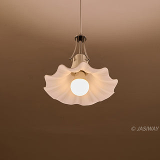 This pendant light features a graceful, trumpet-shaped ceramic shade with delicate, fluted ridges that evoke a refined botanical elegance. The creamy white finish is complemented by a sleek, polished chrome fixture, creating a harmonious balance between soft organic forms and structured metallic elements. Its minimalist yet sculptural design offers a quiet, editorial sophistication perfect for elevating a contemporary interior.