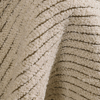 JASIWAY 3-seater fabric sofa featuring a low-profile Japandi silhouette with tufted back cushions and deep-seated upholstery, finished in a textured beige-toned linen-look bouclé fabric that emphasizes a minimalist yet sophisticated living room aesthetic.-Close-up of fabric texture