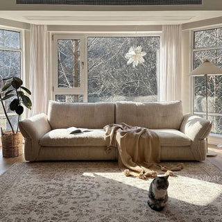 JASIWAY 3-seater fabric sofa featuring a low-profile Japandi silhouette with tufted back cushions and deep-seated upholstery, finished in a textured beige-toned linen-look bouclé fabric that emphasizes a minimalist yet sophisticated living room aesthetic.-Front view