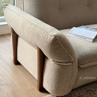 JASIWAY 3-seater fabric sofa featuring a low-profile Japandi silhouette with tufted back cushions and deep-seated upholstery, finished in a textured beige-toned linen-look bouclé fabric that emphasizes a minimalist yet sophisticated living room aesthetic.-Close-up of armrest