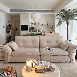 JASIWAY 3-seater fabric sofa featuring a low-profile Japandi silhouette with tufted back cushions and deep-seated upholstery, finished in a textured beige-toned linen-look bouclé fabric that emphasizes a minimalist yet sophisticated living room aesthetic.-Front view