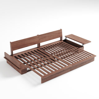 A studio product shot displays an extended dark walnut wood sofa bed frame on a plain white background. The frame features a slatted wooden sleeping surface and two upright backrest panels. Side tables with hinges are attached to the ends, with one open to reveal storage compartments beneath.