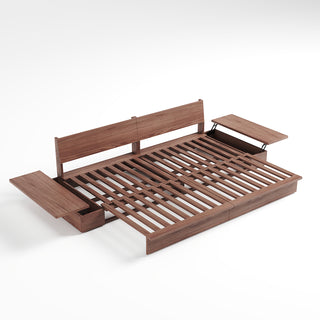 A studio product shot displays an extended dark walnut wood sofa bed frame on a plain white background. The frame features a slatted wooden sleeping surface and two upright backrest panels. Attached side tables feature hinged lids, with both lids lifted open to reveal storage compartments underneath.