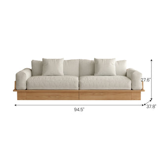 A front-facing view shows a long beige upholstered sectional sofa with a wooden base and armrests against a white background, complete with dimension lines and size callouts. Key measurements include an overall width of 94.5", a depth of 37.8", and a total height of 27.6". Two square accent pillows rest against the back cushions.