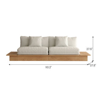 A front-facing view shows a long beige upholstered sectional sofa with a wooden base and built-in side shelves on both ends against a white background, complete with dimension lines and size callouts. Key measurements include an overall width of 110.2", a depth of 37.8", and a total height of 27.6". Two square accent pillows rest against the back cushions.