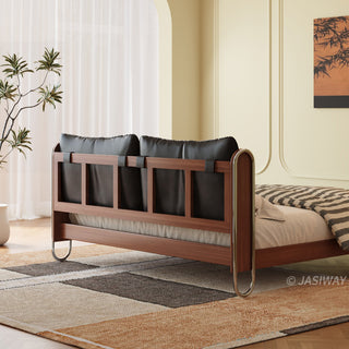 JASIWAY luxury minimalist platform bed with solid wood frame integrated with a curved chrome stainless steel tubular structure, featuring an ergonomic dual-pillow cushioned headboard upholstered in premium black leather, blending mid-century modern craftsmanship with industrial elegance, celebrated as the London Design Awards 2025 Silver Winner for master bedroom furniture design.-Medium shot of bed endboard