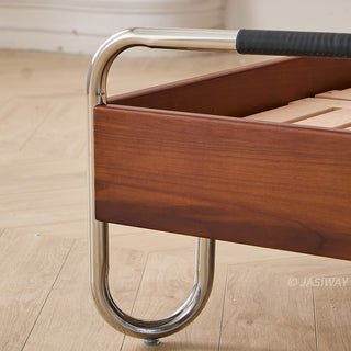 JASIWAY luxury minimalist platform bed with solid wood frame integrated with a curved chrome stainless steel tubular structure, featuring an ergonomic dual-pillow cushioned headboard upholstered in premium black leather, blending mid-century modern craftsmanship with industrial elegance, celebrated as the London Design Awards 2025 Silver Winner for master bedroom furniture design.-Close-up of bed frame corner