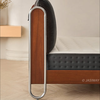 JASIWAY luxury minimalist platform bed with solid wood frame integrated with a curved chrome stainless steel tubular structure, featuring an ergonomic dual-pillow cushioned headboard upholstered in premium black leather, blending mid-century modern craftsmanship with industrial elegance, celebrated as the London Design Awards 2025 Silver Winner for master bedroom furniture design.-Side with of headboard