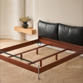 JASIWAY luxury minimalist platform bed with solid wood frame integrated with a curved chrome stainless steel tubular structure, featuring an ergonomic dual-pillow cushioned headboard upholstered in premium black leather, blending mid-century modern craftsmanship with industrial elegance, celebrated as the London Design Awards 2025 Silver Winner for master bedroom furniture design.-High-angle view of internal frame