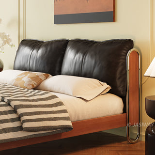 JASIWAY luxury minimalist platform bed with solid wood frame integrated with a curved chrome stainless steel tubular structure, featuring an ergonomic dual-pillow cushioned headboard upholstered in premium black leather, blending mid-century modern craftsmanship with industrial elegance, celebrated as the London Design Awards 2025 Silver Winner for master bedroom furniture design.-Close-up of upholstered headboard