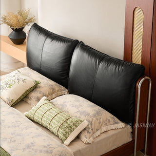 JASIWAY luxury minimalist platform bed with solid wood frame integrated with a curved chrome stainless steel tubular structure, featuring an ergonomic dual-pillow cushioned headboard upholstered in premium black leather, blending mid-century modern craftsmanship with industrial elegance, celebrated as the London Design Awards 2025 Silver Winner for master bedroom furniture design.-High-angle view of headboard