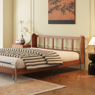 JASIWAY luxury minimalist platform bed with solid wood frame integrated with a curved chrome stainless steel tubular structure, featuring an ergonomic dual-pillow cushioned headboard upholstered in premium black leather, blending mid-century modern craftsmanship with industrial elegance, celebrated as the London Design Awards 2025 Silver Winner for master bedroom furniture design.-Three quarter view without upholstered headboard