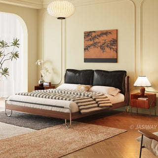 JASIWAY luxury minimalist platform bed with solid wood frame integrated with a curved chrome stainless steel tubular structure, featuring an ergonomic dual-pillow cushioned headboard upholstered in premium black leather, blending mid-century modern craftsmanship with industrial elegance, celebrated as the London Design Awards 2025 Silver Winner for master bedroom furniture design.-Three quarter view