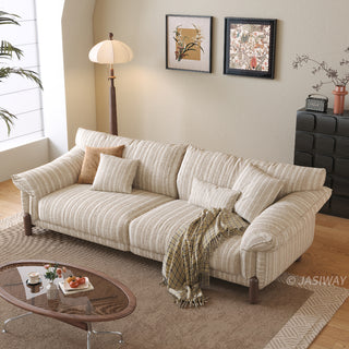 JASIWAY modern 3-seater sofa featuring a premium striped upholstery with deep-seated comfort, plush oversized cushions, flared armrests and solid wood legs in a dark walnut finish, showcasing a minimalist Japandi and organic modern aesthetic. -High-angle view