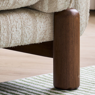 JASIWAY modern 3-seater sofa featuring a premium striped upholstery with deep-seated comfort, plush oversized cushions, flared armrests and solid wood legs in a dark walnut finish, showcasing a minimalist Japandi and organic modern aesthetic. -Close-up of solid wood leg