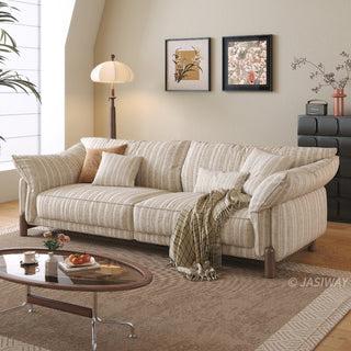JASIWAY modern 3-seater sofa featuring a premium striped upholstery with deep-seated comfort, plush oversized cushions, flared armrests and solid wood legs in a dark walnut finish, showcasing a minimalist Japandi and organic modern aesthetic. -Three-quarter view