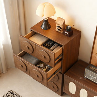 JASIWAY walnut-finished modular storage cabinet showcasing its stackable 2-drawer design with distinctive oversized circular relief pulls and rich wood grain texture, suitable for organic modern and minimalist interiors.-High-angle view of drawers open