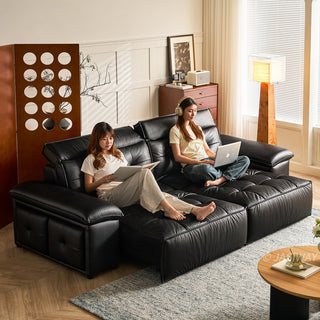 JASIWAY premium leather power reclining sleeper sofa featuring deep button-tufted backrests, adjustable panoramic headrests, and a unique open-concept recessed armrest with built-in storage, highlighting luxurious ergonomics, integrated technology, and space-saving functional furniture design for modern high-end homes.-Three quarter view with model reclining