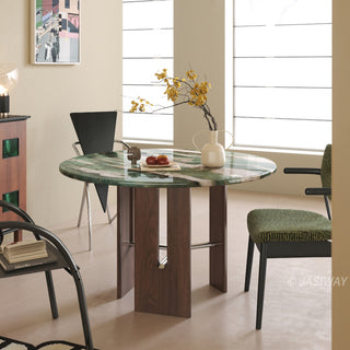 JASIWAY round dining table featuring a vibrant marble top with a polished finish, supported by a sculptural dark wood pedestal base with sleek metal cross-bar accents and an architectural open-frame storage design for modern kitchen interiors.-Diagonal view