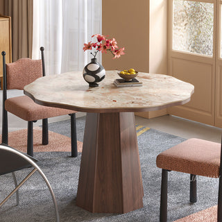 JASIWAY round dining table featuring a uniquely scalloped-edge sintered stone top, supported by a faceted sculptural pedestal base in a rich walnut wood finish, blending organic modern silhouettes with mid-century design elements for a dining room centerpiece.-Slight high-angle view of natural light