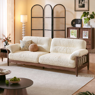 JASIWAY modern upholstered couch featuring a premium textured fabric over deeply tufted cushions, built on a sturdy mid-century walnut finish solid wood frame with exposed spindle arms, featuring a removable washable slipcover for an elegant yet functional living room seating solution.-Three quarter view