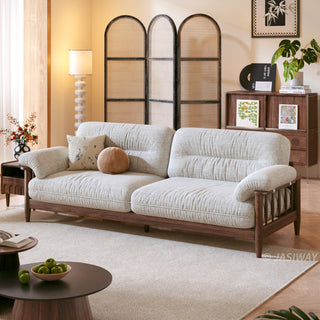 JASIWAY modern upholstered couch featuring a premium textured fabric over deeply tufted cushions, built on a sturdy mid-century walnut finish solid wood frame with exposed spindle arms, featuring a removable washable slipcover for an elegant yet functional living room seating solution.-Three quarter view