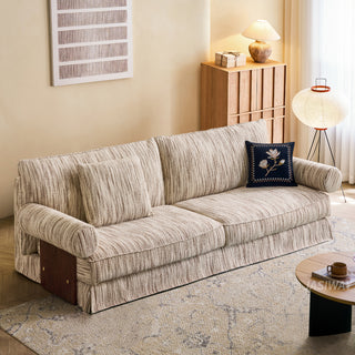 JASIWAY textured linen blend sofa, featuring a minimalist upholstery with a subtle linear weave, highlighting its plush, oversized bolsters and the architectural solid wood side panels, perfect for contemporary living rooms.-Three-quarter view