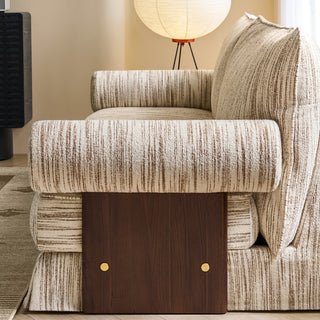JASIWAY textured linen blend sofa, featuring a minimalist upholstery with a subtle linear weave, highlighting its plush, oversized bolsters and the architectural solid wood side panels, perfect for contemporary living rooms.-Side view