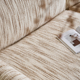 JASIWAY textured linen blend sofa, featuring a minimalist upholstery with a subtle linear weave, highlighting its plush, oversized bolsters and the architectural solid wood side panels, perfect for contemporary living rooms.-Close-up of material texture