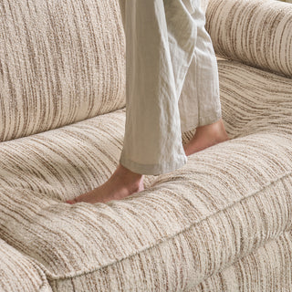 JASIWAY textured linen blend sofa, featuring a minimalist upholstery with a subtle linear weave, highlighting its plush, oversized bolsters and the architectural solid wood side panels, perfect for contemporary living rooms.-Close-up