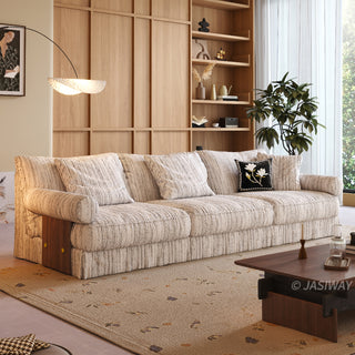 JASIWAY textured linen blend sofa, featuring a minimalist upholstery with a subtle linear weave, highlighting its plush, oversized bolsters and the architectural solid wood side panels, perfect for contemporary living rooms.-Three-quarter view