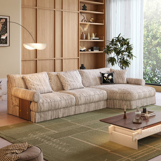 JASIWAY textured linen blend sofa, featuring a minimalist upholstery with a subtle linear weave, highlighting its plush, oversized bolsters and the architectural solid wood side panels, perfect for contemporary living rooms.-Three-quarter view