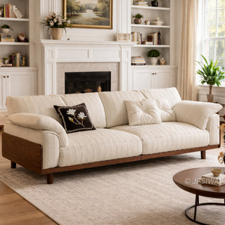 JASIWAY mid-century modern 3-seater sofa featuring premium top-grain leather upholstery with hand-stitched detailing, plush oversized armrests, and a sturdy solid wood exposed frame base in a walnut finish for a luxury living room aesthetic.-Three-quarter view