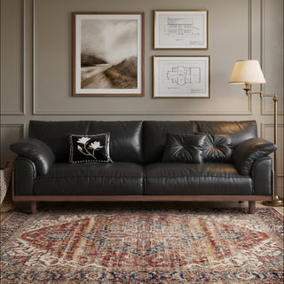 JASIWAY mid-century modern 3-seater sofa featuring premium top-grain leather upholstery with hand-stitched detailing, plush oversized armrests, and a sturdy solid wood exposed frame base in a walnut finish for a luxury living room aesthetic.-Front view