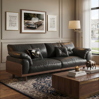 JASIWAY mid-century modern 3-seater sofa featuring premium top-grain leather upholstery with hand-stitched detailing, plush oversized armrests, and a sturdy solid wood exposed frame base in a walnut finish for a luxury living room aesthetic.-Three-quarter view