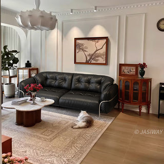 JASIWAY luxurious 3-seater modern couch featuring premium tufted genuine leather upholstery and a sleek wraparound sturdy frame, designed for contemporary living room aesthetics with deep-buttoned cushioning and ergonomic support.-Wide angle interior