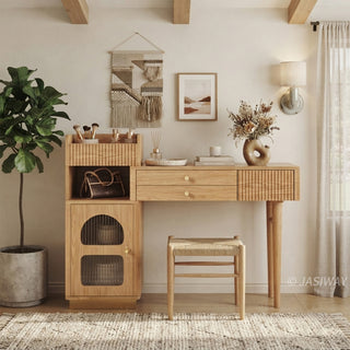 Bohemian lifestyle view of a modern wooden vanity desk with fluted storage, a matching stool, and woven wall art in a warm bedroom setting.
