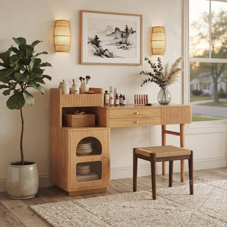 Japandi lifestyle view of a modern wooden vanity desk with fluted storage, a matching stool, and wall sconces in a serene bedroom setting.
