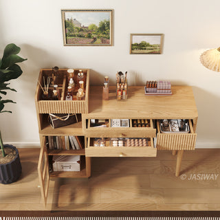 High-angle lifestyle view of a modern wooden vanity desk with open drawer compartments, fluted storage, and organized cosmetics in a warm bedroom setting.