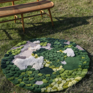 RINGCHEN hand-tufted round area rug with a 3D forest moss design, featuring sculptural high-low pile in shades of deep emerald, sage green, and earthy grey to mimic a natural forest floor.-High-angle lifestyle shot