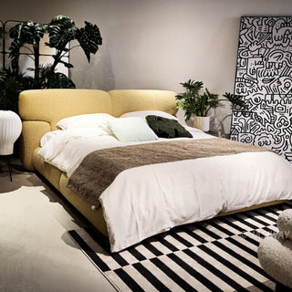 RINGCHEN bouclé upholstered platform bed frame featuring a modern curved headboard and low-profile minimalist design, premium textured cream bouclé fabric queen/king size bed with seamless soft-touch upholstery for contemporary master bedroom decor.-High-angle view