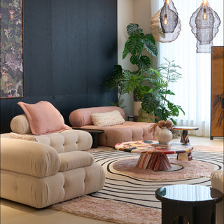 RINGCHEN petal pink and obsidian abstract round rug featuring a high-low tufted texture and organic circular ripples, showcases a hand-drawn tree ring motif with soft pink shaggy edges and crisp black line, blending modern minimalism with poetic visual storytelling.-Low angle view