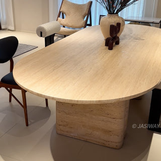 RINGCHEN Luna travertine oval dining table featuring natural Italian-style travertine with a distinctive sculptural fluted pedestal base; a centerpiece for modern organic interior design.-Low angle view