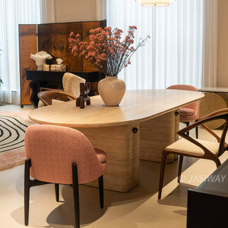 RINGCHEN Luna travertine oval dining table featuring natural Italian-style travertine with a distinctive sculptural fluted pedestal base; a centerpiece for modern organic interior design.-Three-quarter lifestyle view