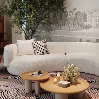 RINGCHEN luxury curved bouclé sectional sofa featuring a modular crescent moon design, upholstered in premium white cloud-textured bouclé fabric. This designer modular couch showcases a minimalist semi-circular silhouette, low-profile frame, and soft organic lines, ideal for modern luxury living rooms and contemporary open-concept spaces.-Medium shot