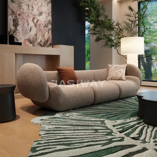 RINGCHEN luxury Italian curved pod sofa featuring a sculptural, ergonomic silhouette with premium cotton-linen upholstery, a 3-seater modular pod design with distinctive rounded bolsters and a seamless, low-profile aesthetic for contemporary luxury living rooms.-Low-angle view