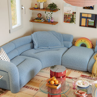 RINGCHEN modern cloud modular sectional sofa with a luxurious curved silhouette and light blue bouclé upholstery, featuring a modular design with high-density foam cushioning, rounded armrests, and a low-profile cloud-like aesthetic, perfect for high-end modern living room interiors and luxury home staging.-High-angle view