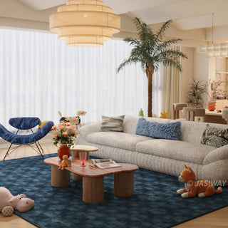 RINGCHEN modern curved cloud sofa featuring premium blush textured upholstery, highlighted by its signature sculptural low-profile silhouette, channel-tufted base detailing, and deep-seated organic cushioning for a high-end minimalist living room aesthetic.-Three quarter view