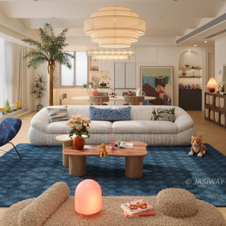 RINGCHEN modern curved cloud sofa featuring premium blush textured upholstery, highlighted by its signature sculptural low-profile silhouette, channel-tufted base detailing, and deep-seated organic cushioning for a high-end minimalist living room aesthetic.-Front view
